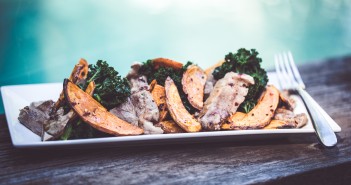 Honey spiced pork with smoked paprika potato chips and kale